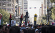 Iranian protesters carry scale models of Iran-made ballistic missiles during an anti-U.S....