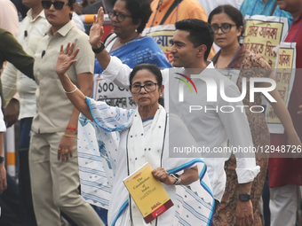 Trinamool Congress (TMC) party's chairperson and India's West Bengal state chief minister Mamata Banerjee holds the India Constitution book... by Debajyoti Chakraborty/NurPhoto