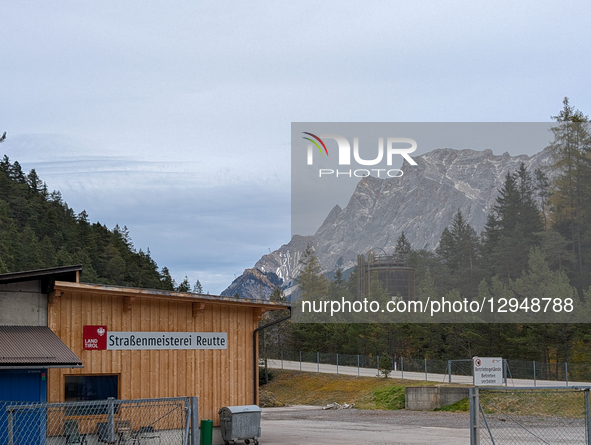 The building and yard of the Strassenmeisterei Reutte (Reutte Road Maintenance Depot) are visible near a wooded hillside in Biberwier, Tyrol... by Michael Nguyen/NurPhoto