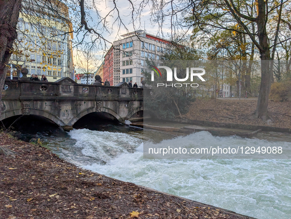 The famous Eisbach wave is gone. Spectators watch the flat river water of the Eisbach in Munich, Bavaria, Germany, on November 4, 2025. Surf... by Michael Nguyen/NurPhoto