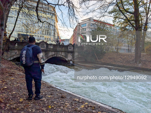The famous Eisbach wave is gone. Spectators watch the flat river water of the Eisbach in Munich, Bavaria, Germany, on November 4, 2025. Surf... by Michael Nguyen/NurPhoto