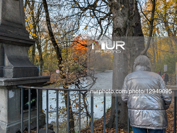 The famous Eisbach wave is gone. Spectators watch the flat river water of the Eisbach in Munich, Bavaria, Germany, on November 4, 2025. Surf... by Michael Nguyen/NurPhoto