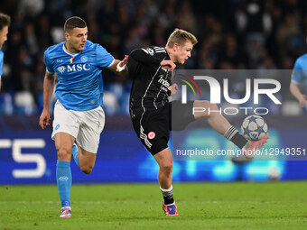 Alessandro Buongiorno of S.S.C. Napoli and Jonathan Burkardt of Eintracht Frankfurt are in action during the UEFA Champions League phase day... by Domenico Cippitelli/NurPhoto
