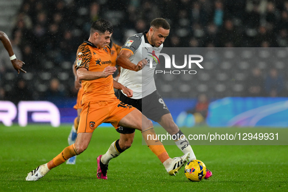 Carlton Morris of Derby County battles with John Egan of Hull City during the Sky Bet Championship match between Derby County and Hull City... by MI News/NurPhoto