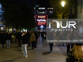 People walk past shops in the city center in Warsaw, Poland, on November 4, 2025.  by Aleksander Kalka/NurPhoto