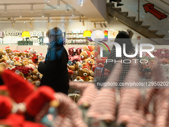 People shop for Christmas-themed products in Warsaw, Poland, on November 4, 2025.  by Aleksander Kalka/NurPhoto
