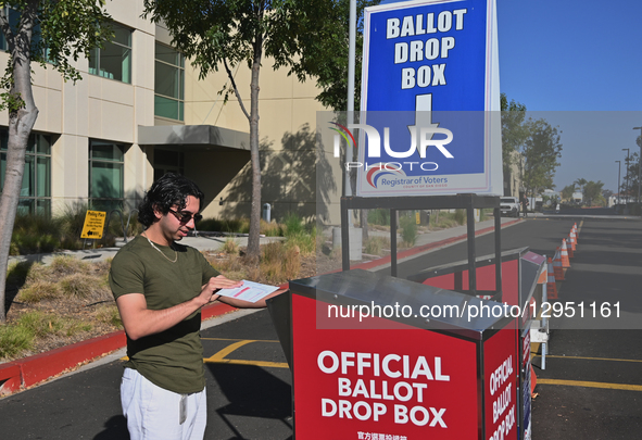 Voter Adrian Chipres drops his mail-in ballot off at the San Diego County Registrar of Voters office in San Diego, United States, on Novembe... by Carlos Moreno/NurPhoto
