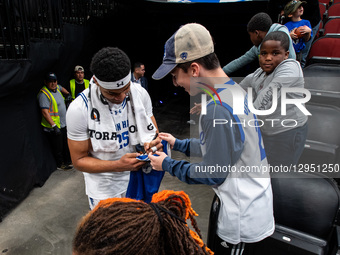 NAJAI HINES (25) autographs for fans after an NCAA basketball game at Prudential Center in Newark, United States, on November 3, 2025.  by Dan Squicciarini/NurPhoto