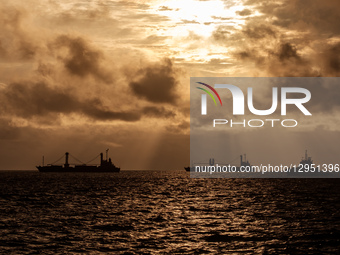A container ship carries pure nickel ore belonging to a nickel mining company and processing smelter in Kawasi Village, Obi Island, South Ha... by Muhammad Fauzy/NurPhoto