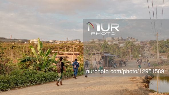 Miners walk towards the mining industry company in Kawasi Village, Obi Island, South Halmahera Regency, North Maluku Province, Indonesia, on... by Muhammad Fauzy/NurPhoto