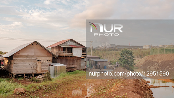 The area of wooden houses belongs to residents around the mining industry company and nickel ore processing smelter in Kawasi Village, Obi I... by Muhammad Fauzy/NurPhoto
