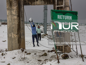 Tourists flock to Gulmarg, a renowned ski resort in Jammu and Kashmir, India, on November 5, 2025, to experience the season's first snowfall... by Nasir Kachroo/NurPhoto