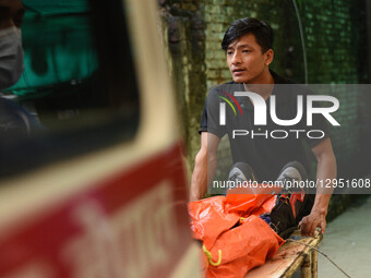 Hospital staff unload the body of a climber who dies in an avalanche on Mount Yalung Ri at the morgue of Tribhuvan University Teaching Hospi... by Safal Prakash Shrestha/NurPhoto