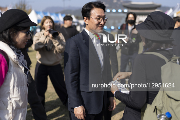 Prime Minister Kim Min-seok speaks with citizens while touring the ''Development Cooperation Week Promotion Zone'' at Gwanghwamun Square in... by Chris Jung/NurPhoto