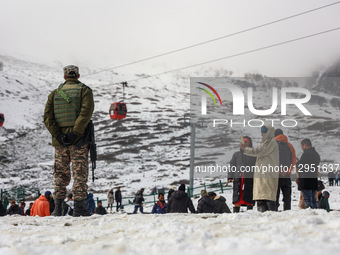 An Indian soldier stands alert as tourists flock to Gulmarg, a renowned ski resort in Jammu and Kashmir, India, on November 5, 2025, to expe... by Nasir Kachroo/NurPhoto