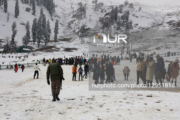 Tourists flock to Gulmarg, a renowned ski resort in Jammu and Kashmir, India, on November 5, 2025, to experience the season's first snowfall... by Nasir Kachroo/NurPhoto