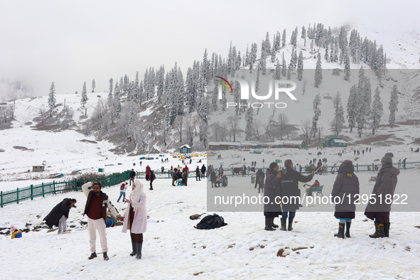 Tourists flock to Gulmarg, a renowned ski resort in Jammu and Kashmir, India, on November 5, 2025, to experience the season's first snowfall... by Nasir Kachroo/NurPhoto