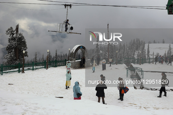 Tourists flock to Gulmarg, a renowned ski resort in Jammu and Kashmir, India, on November 5, 2025, to experience the season's first snowfall... by Nasir Kachroo/NurPhoto
