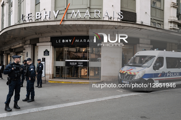 Riot police officers stand guard as people protest in front of the BHV department store in Paris, France, on November 5, 2025, on the openin... by Jerome Gilles/NurPhoto
