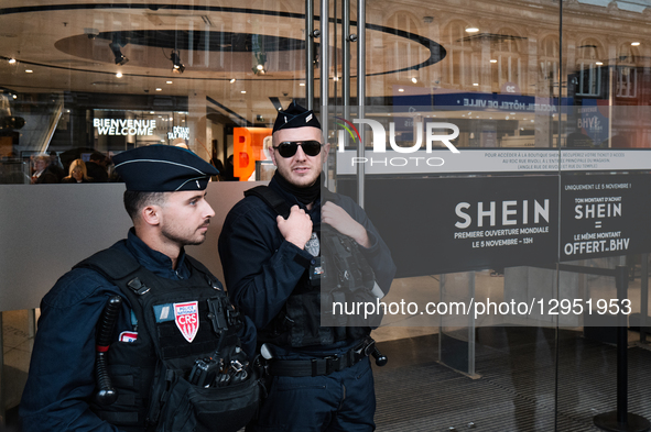 Riot police officers stand guard as people protest in front of the BHV department store in Paris, France, on November 5, 2025, on the openin... by Jerome Gilles/NurPhoto