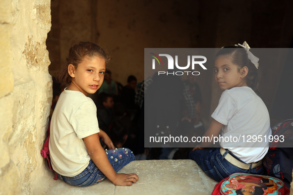 Palestinian children attend a class in the historic ''Al-Kamaliya al-Othmanya'' school in Gaza City's Old Town as part of a volunteer initia... by Majdi Fathi/NurPhoto