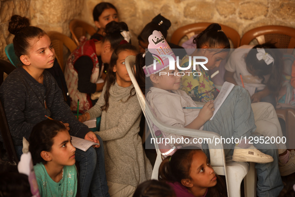 Palestinian children attend a class in the historic ''Al-Kamaliya al-Othmanya'' school in Gaza City's Old Town as part of a volunteer initia... by Majdi Fathi/NurPhoto