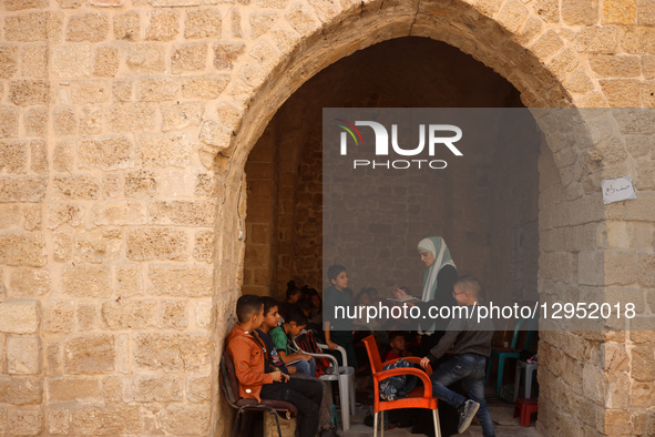 Palestinian children attend a class in the historic ''Al-Kamaliya al-Othmanya'' school in Gaza City's Old Town as part of a volunteer initia... by Majdi Fathi/NurPhoto