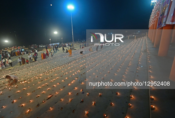Devotees light traditional oil lamps as they celebrate the Hindu festival of 'Dev Deepawali' at Sangam, the confluence of the rivers Ganges,... by Sanjay Kanojia/NurPhoto