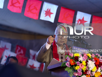 Former Nepali Prime Minister Madhav Kumar Nepal gestures as he delivers a speech addressing the merger announcement ceremony of the ten comm... by Subaas Shrestha/NurPhoto