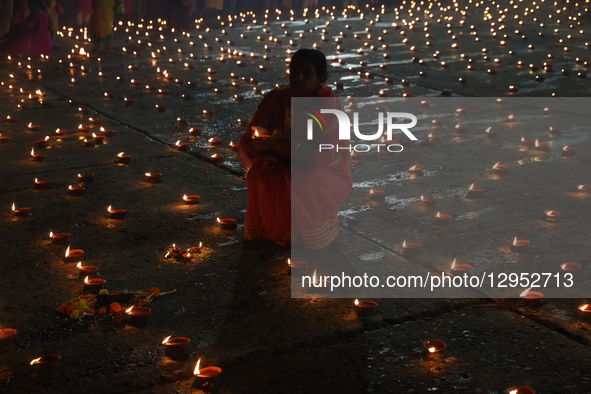 Hindu devotees light oil lamps on the banks of the river Ganges on the occasion of the Hindu religious festival of Dev Deepawali in Kolkata,... by Rupak De Chowdhuri/NurPhoto