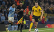 Matheus Nunes #27 of Manchester City F.C. challenges Nico Schlotterbeck #4 of Borussia Dor...