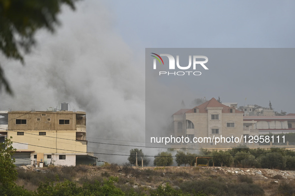 Smoke billows from the area following Israeli attacks on the town of Tayr Dibba in the southern Lebanese province of Tyre, Lebanon, on Novem... by Fadel Itani/NurPhoto