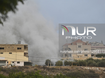 Smoke billows from the area following Israeli attacks on the town of Tayr Dibba in the southern Lebanese province of Tyre, Lebanon, on Novem... by Fadel Itani/NurPhoto
