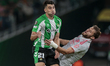 Marc Roca of Real Betis competes for the ball with Tanner Tessmann of Olympique de Lyon du...
