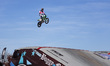 Riders perform during a freestyle show at Motolive Arena on the first day of opening to th...