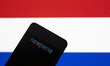 Photo illustration of Nexperia logo displayed on a smartphone screen with the Dutch flag i...