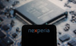 Photo illustration of Nexperia logo displayed on a smartphone screen while a technological...