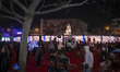 Iranian people gather in an area after attending a state event unveiling a sculpture of th...