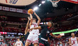 Wisconsin Badgers guard Hayden Jones (13) hesitates before going up for a layup while Nort...