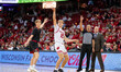Wisconsin Badgers guard Isaac Gard (15) hits a three-pointer while his father, Wisconsin B...