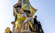 In Turin, Italy, on November 7, 2025, Extinction Rebellion covers the statue of Camillo Ca...