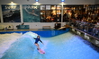 Surfer Lea Sasse competes in the women's category of the first international indoor surfin...