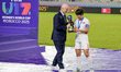 #3 Ri R. Jin A (Defender) of Korea DPR U-17 receives the trophy from FIFA President Gianni...