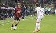 Alexis Saelemaekers of AC Milan competes for the ball with Mathias Fjortoft Lovik of Parma...