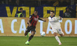 Pervis Estupinan of AC Milan competes for the ball with Adrian Bernabe of Parma AC during...