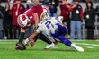 Wisconsin Badgers linebacker Mason Posa (8) causes a fumble by Washington Huskies quarterb...