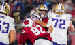 Wisconsin Badgers outside linebacker Corey Walker (92) hits Washington Huskies quarterback...