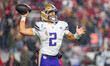 Washington Huskies quarterback Demond Williams Jr. (2) looks to pass against the Wisconsin...
