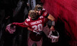 Wisconsin Badgers quarterback Carter Smith (5) celebrates with Wisconsin Badgers safety Lu...