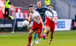 Utrecht player Nick Viergever (L) duels with Ajax player Wout Weghorst (R) during the matc...